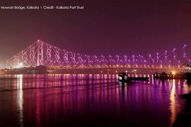 Howrah Bridge lit up over the river, AI generated