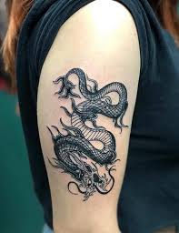 You can get a large size dragon tattoo, which would cover your entire arm from your wrist to your shoulder. Minimalist One Line Dragon Tattoo Novocom Top