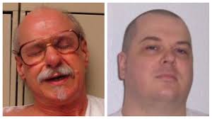 Hutchinson schedules execution for one murderer, spares another