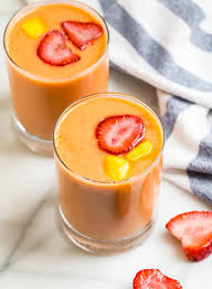 A refreshing smoothie made with homemade almond milk and fresh frozen banana, another way to enjoy the goodness of almond milk! Strawberry Mango Smoothie Easy Creamy Healthy Wellplated Com