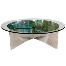Lit from inside the antiqued mirror surface, candlelight takes on a softer glow. Unusual Concave Green Mercury Glass Coffee Table At 1stdibs