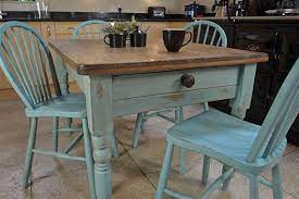 All representing a traditional shabby chic design, with gentle adornments and slat back chairs. Shabby Chic Farmhouse Rustic Dining Table With 4 Stickback Chairs Free Uk Delivery Shabby Chic Kitchen Table Shabby Chic Dining Tables Shabby Chic Dining