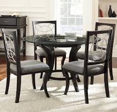 Delano 7 piece dining room set belongs to delano collection by steve silver. Cayman 5 Piece Glass Top Dining Set By Steve Silver At Prime Brothers Furniture Dining Table Black Dining Room Sets Round Pedestal Dining Table