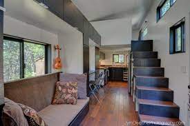 This two bedroom house plan has a larger living room that comes together with an open kitchen. Home Tiny House 28 X8 6 Tiny House Plans