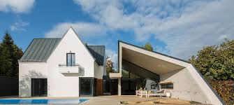 The result is an asymmetrical roof and a home with much more space than one with a similarly sized. Asymmetrical Concrete Architecture