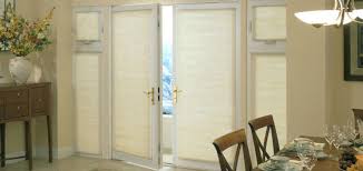 Get a bunch of paint stir sticks, dip them in a paint color of your choice and hang them from a tension rod. Glass Door Window Covering Ideas