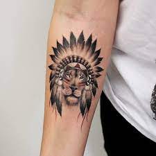 50 Amazing Lion Tattoos Along With Their Meanings Headdress Tattoo Tattoos Indian Tattoo