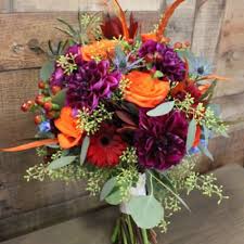We offer a wide range of floral arrangements that are aesthetically pleasing and will make for a great addition to their spaces. Shining Jewel Tones Hand Tied Bouquet In Edison Nj E E Flowers