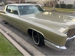 Image result for Medium Gold 1969 Cadillac
