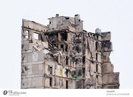 destroyed and burned houses in the city ...