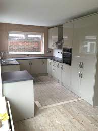 Kitchen Installation We Fitted A Gloss Grey Kitchen With Integrated Appliances We Fitted Laminate Worktops Fit Kitchen Installation Laminate Worktop Kitchen