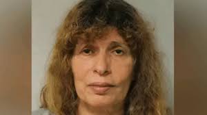 Sister jailed for murdering film director and stealing her Rolex
