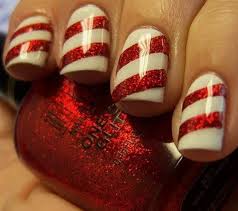 Lively, joyous, wearing a long red coat and red trousers, black boots and white collar; Best Easy Simple Christmas Nail Art Designs Ideas