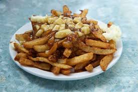 Poutine is a simple yet indulgent canadian dish made of crispy french fries and chunks of salty, softened cheese curds smothered in a tangy gravy. Poutine Quebec S Leibspeise Faszination Kanada