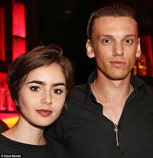 Lily Collins and Jamie Campbell Bower reunite at music event after her  Greek holiday