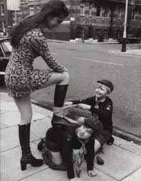 London, 1972: Cub Scouts Taking Part in Operation Shoeshine attend to  actress Caroline Munros boots. : rOldSchoolCool