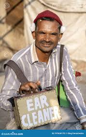 Indian Man Offers Ears Cleaning in the ...