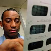 Lt. Matthew Conquest, of Flushing, Mich., prepares to perform a pulp test 