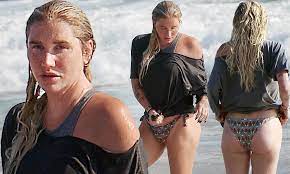 Kesha takes a dip in the ocean wearing bikini bottoms and a black top |  Daily Mail Online