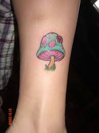 Small red mushroom tattoo on left hand. Dark Mushroom Tattoos
