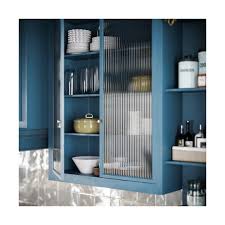 Robin Kitchen: A Tranquil Beauty A serene C-shaped kitchen in robin's egg  blue, featuring classic shutters, fluted glass cabinets, and gold cup  handles. A space where elegance meets tranquility. #RobinKitchen #kitchen  #kitchendesign #