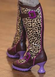 Wearing my Fluenicorns today. It was difficult to get a good photo today.  The tights are purple/black stripes from SNAG. Thanks to Janice Mapes  Stafford for her fashion photography skills