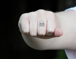 Chic And Stylish Designs Of Tattoos For Women Small Skull Tattoo Pirate Skull Tattoos Finger Tattoos
