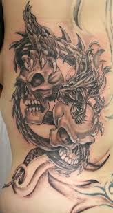Sleeve tattoos skull tattoo flowers skull rose tattoos bird tattoos. Dragon Skulls Tattoo Dragon Tattoo With Skull Dragon Tattoo Designs Picture Tattoos