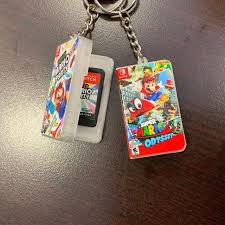 Este es el primer juego de mario en un mundo abierto desde super mario 64 para nintendo 64 y super mario sunshine para nintendo gamecube. Llaveros De Fundas De Almacenamiento De Juegos Nintendo Switch Etsy Game Storage Origami King Kirby Star Allies