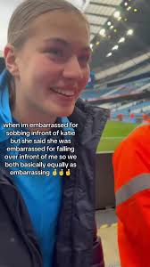 Katie Sneezing in Front of A Football Team