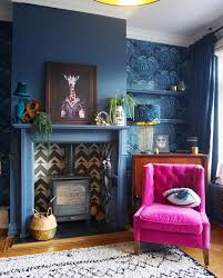 Use the small space to your advantage and make it feel like a. Dark Blue Living Room Walls With Fuchsia Pink Velvet Accent Chair And Alcove Wallpapering Blue Walls Living Room Trendy Living Room Wallpaper Blue Living Room