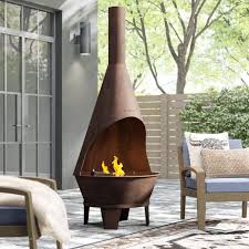 Hn outdoor brecksville propane gas fire pit. 10 Best Chiminea Fire Pits For Your Backyard Clay Steel And More Hgtv