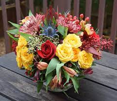 Autumn Is Here Fall Flower Arrangement With Berries And Thistle Spray Roses Alstroemeria Mums Safari Sunset S Flower Arrangements Flower Delivery Flowers