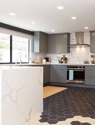 Tile To Wood Transition In This Mid Century Modern Kitchen As Seen On Hgtv S Hiddenpote Modern Kitchen Flooring Modern Kitchen Tiles Modern Kitchen Tile Floor