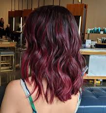 This style features layered hair with vibrant red highlights. 35 Incredible Black Hairstyles With Red Highlights
