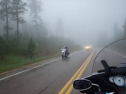 Water drops on the windshield, traffic in the city on a rainy day at evening. Murphy S Law Of Riding In The Rain Motorbike Writer