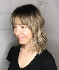 No other steps up the haircut for sleek hair like arched bangs! 25 Latest Medium Length Hairstyles With Bangs For 2021