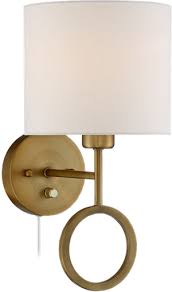 And as an added bonus, wall sconces free up table (and floor) space where you'd typically put a regular lamp. Amidon Warm Brass Drop Ring Plug In Wall Lamp Decorist