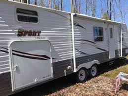 It has various floor plans, a huge bed, motion sensor lights, a microwave, an oven, a. Dutchmen Sport Pack N Play 2010 29 Ft Bunkhouse Camper With Vans Suvs And Trucks Cars