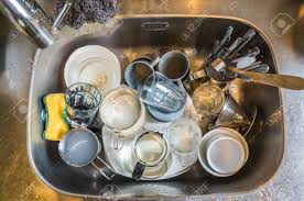 dirty dishes in the kitchen sink at