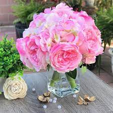 Here, you can find stylish peony faux flowers that cost less than you thought possible. Enova Home Pink Peony And Hydrangea Mixed Faux Flower Arrangement With Clear Glass Vase Overstock 27754631