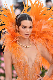 Part one of the costume institute's exploration of the nation's sartorial identity, in america michelle obama's style evolution—8 years in. Kendall Jenner Wears Orange Feathered Dress To Met Gala 2019