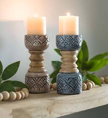 Made with solid mango wood, they're a rustic yet modern addition to everyday—or special occasion—decor. Mango Wood Pillar Candlesticks Blue Stone Vivaterra Wood Pillar Candle Holders Candlesticks Wood Candle Sticks