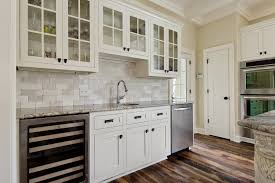 In this contemporary kitchen by davis design group, a stacked stone backsplash makes a statement by showing off its naturally pockmarked surface. Sarisand Tile Designer Kitchen Showroom Charlottesville Bath Kitchen Design