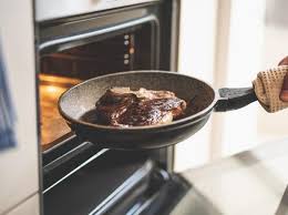 Using an oven mitt or thick dish towel, transfer the hot cast iron skillet from the oven to the stovetop. How To Cook Steak In The Oven Cooking School Food Network