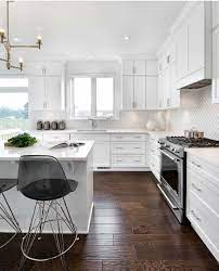 Since gray blends in well with almost any other colors, you'll find that having gray floors still allows you plenty of freedom to introduce other colors into your kitchen. Pin By Karenina Fernandez On Kitchens Gorgeous White Kitchen Interior Design Kitchen Wood Floor Kitchen