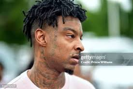 Rapper 21 Savage attends 4th Annual Issa Back 2 School Drive Hosted... News  Photo
