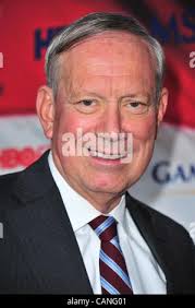 New York Gov. George Pataki left, consoles Maria Pena, second left, mother  of sisters Maria Herrera, and Dilcia Pena, and grandmother to Herrera's  4-year-old son, Andy, at a memorial service held at