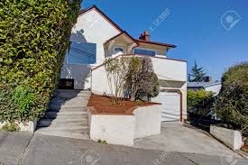 We are interested in widening the wood window trim on our stucco house. Nice Home Exterior With White Stucco And Brown Trim On A Sunny Day Stock Photo Picture And Royalty Free Image Image 99583892