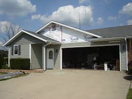 On pitched triangles j channel is on the bottom only because the vent is all the way up against the soffit in the peak and the top is typically screwed on. Dutch Lap Vinyl Siding W Shake Gables Edgerton Ohio Jeremykrill Com